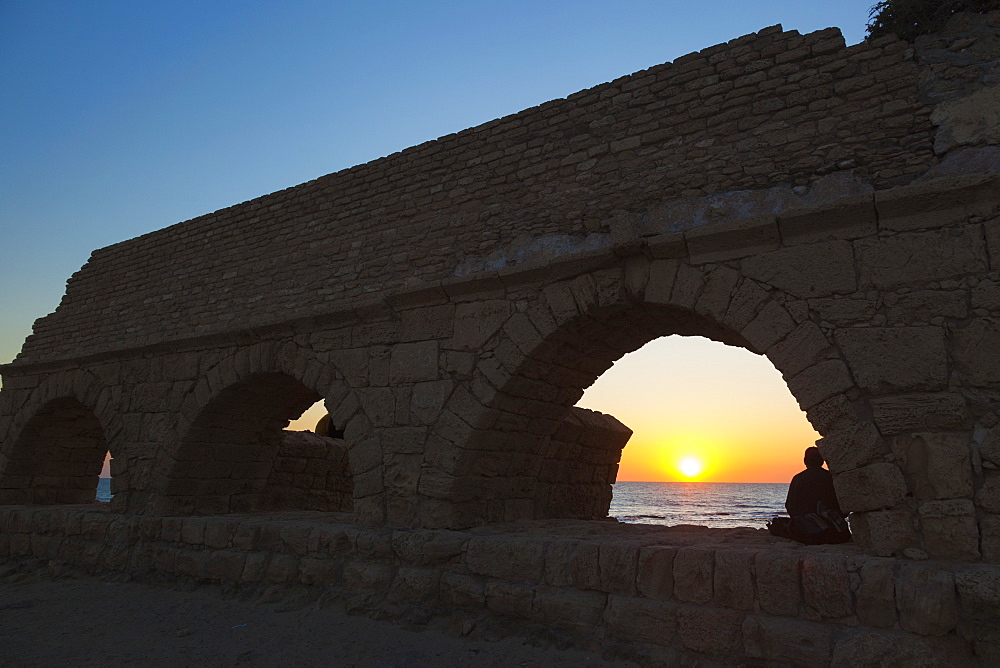 Roman Aqueduct With Arches At Sunset In Caesarea Maritima National Park, Israel