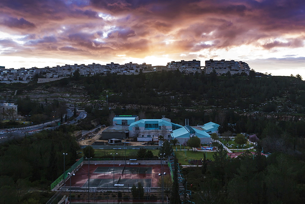 Modern Buildings And Tennis Courts Under Glowing Clouds At Sunset, Israel