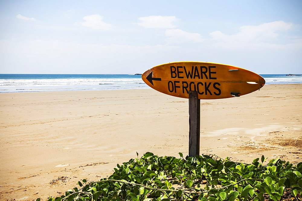 A Warning Sign On A Surfboard In Playa Hermosa, Nicaragua