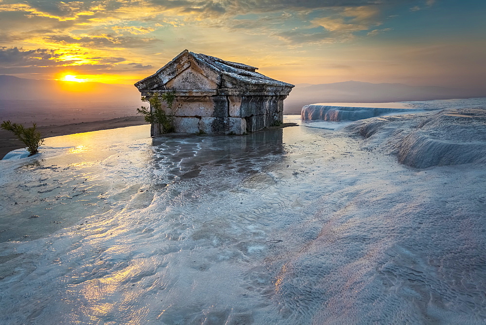 Tomb Submerged In A Travertine Pool In Hierapolis At Sunset, Pamukkale, Turkey