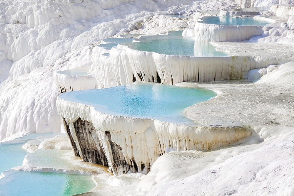 Hot Springs And Travertines, Terraces Of Carbonate Minerals Left By The Flowing Water, Pamukkale, Turkey