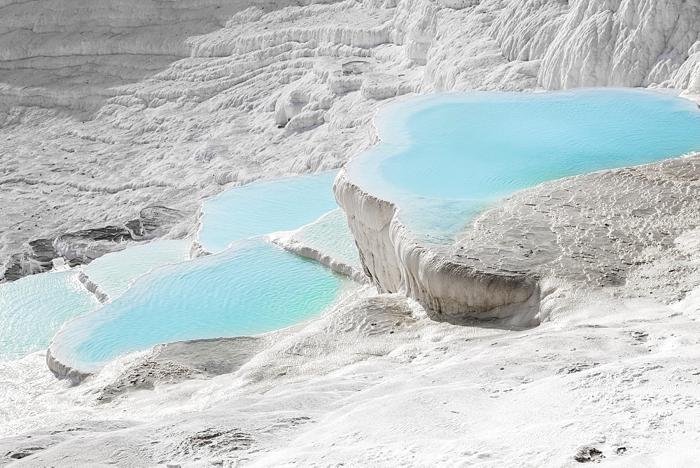 Hot Springs And Travertines, Terraces Of Carbonate Minerals Left By The Flowing Water, Pamukkale, Turkey