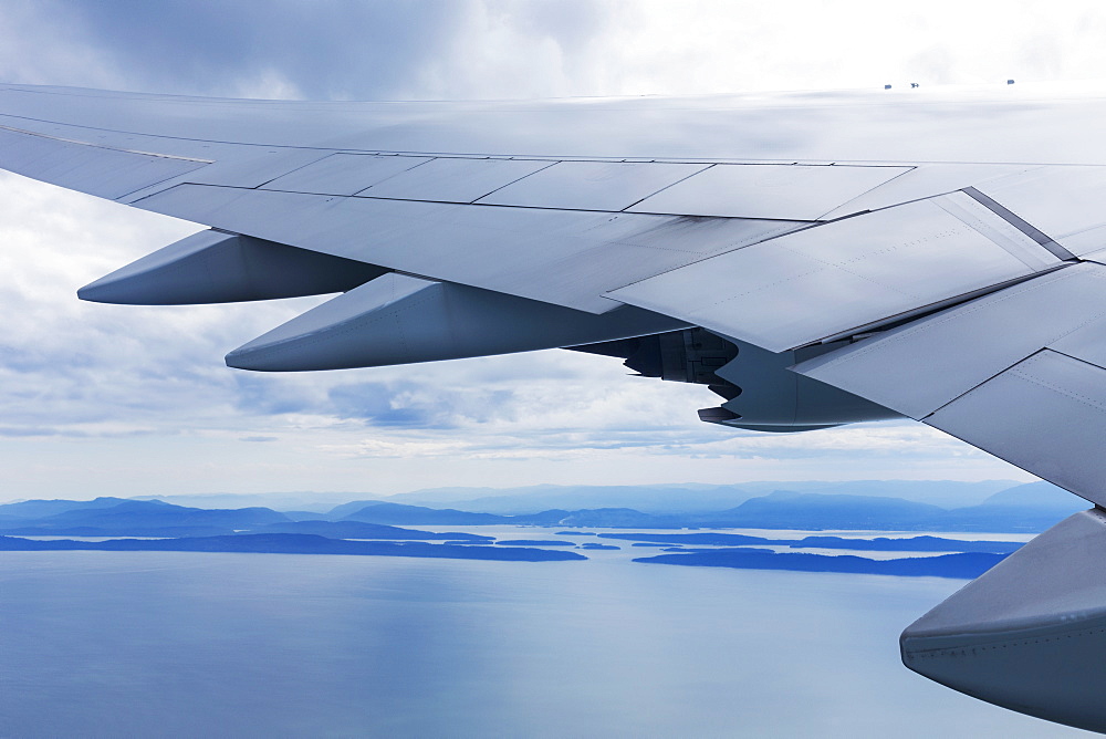 Korean Air Boeing 747 Approaching Vancouver On A Late Afternoon In Summer, Over A Calm Ocean With Islands And The Coastline Of British Columbia Receding Into The Distance, Vancouver, British Columbia, Canada