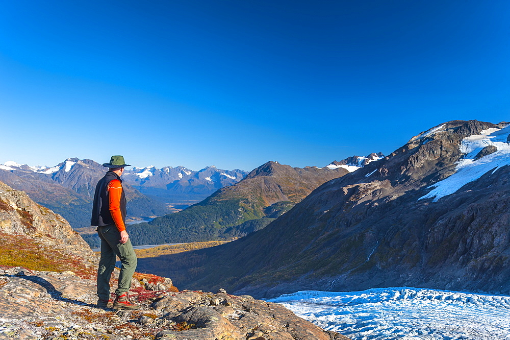 A Man Hiking Near An Unnamed Lake Near The Harding Icefield Trail In Kenai Fjords National Park On A Summer Day, South-Central Alaska, Alaska, United States Of America