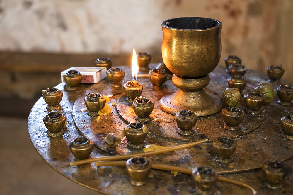 Lit Candle In The Interior Of The Church Of The Saint George At Gelati Monastery, Imereti, Georgia