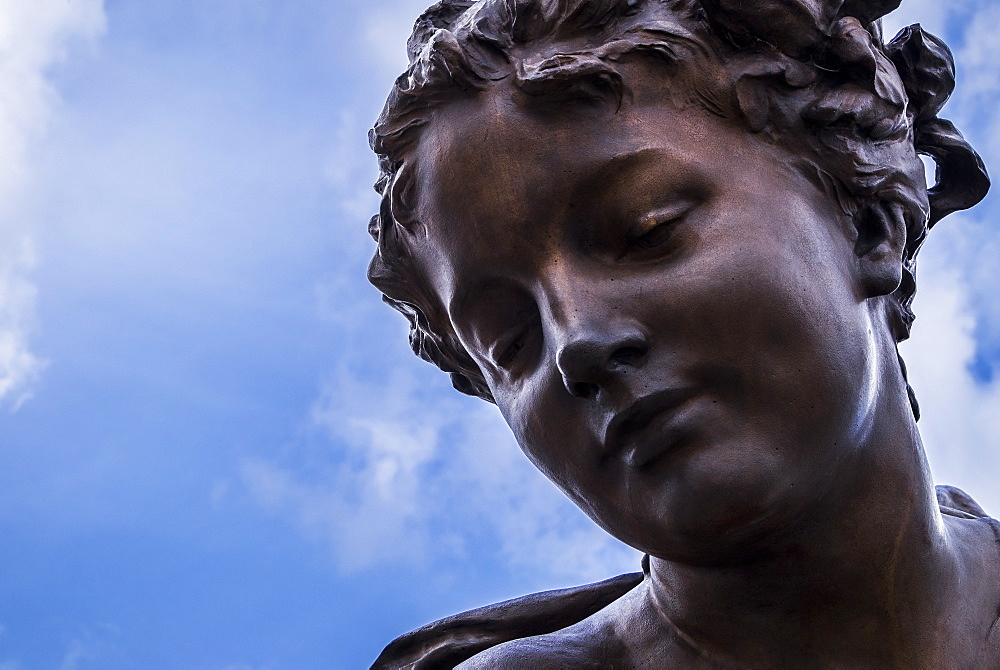 The Beautiful Face Of A Female Statue Made Of Bronze, Paris, France