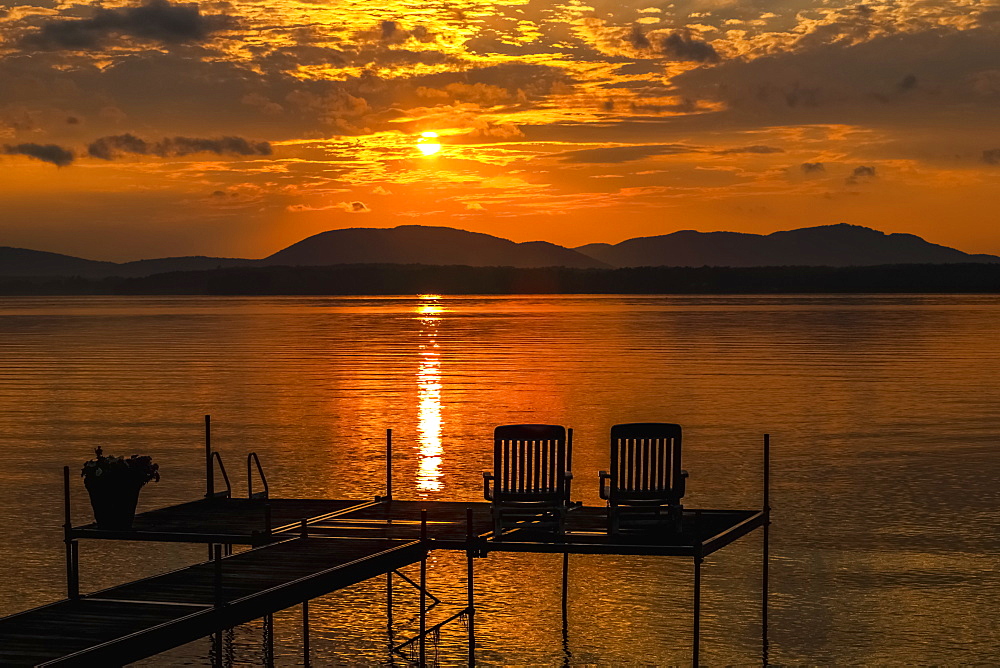 Sunset On Lake With Silhouetted Chairs On Wharf, Knowlton, Quebec, Canada