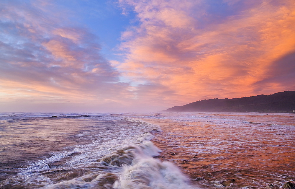 Vibrant Red Sunset Over Cobden Beach And Waves, Sunset Reflected In The Sea, Greymouth, South Island, New Zealand