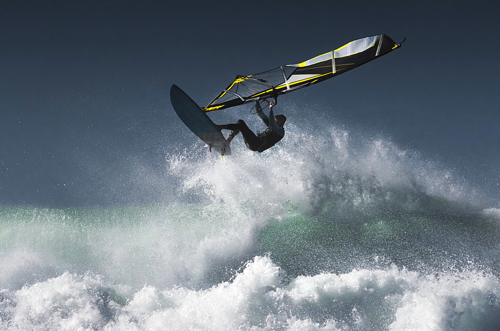 Windsurfer In The Air Above Splashing Waves, Tarifa, Cadiz, Andalusia, Spain