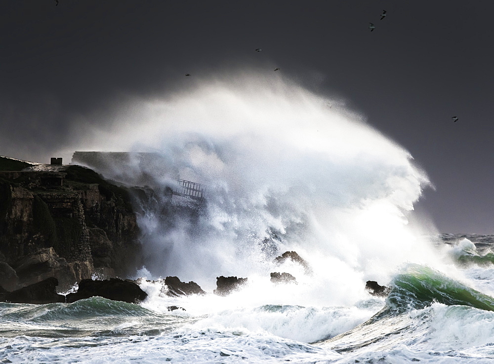 Wave Crashing Into Shore And Splashing Onto The Land Above The Cliffs, Isla De La Palomas, Tarifa, Cadiz, Andalusia, Spain