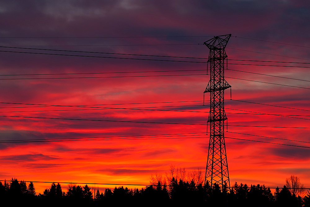 Silhouette Of A Tall Metal Electrical Tower With Colourful Dramatic Sky At Sunrise, Calgary, Alberta, Canada