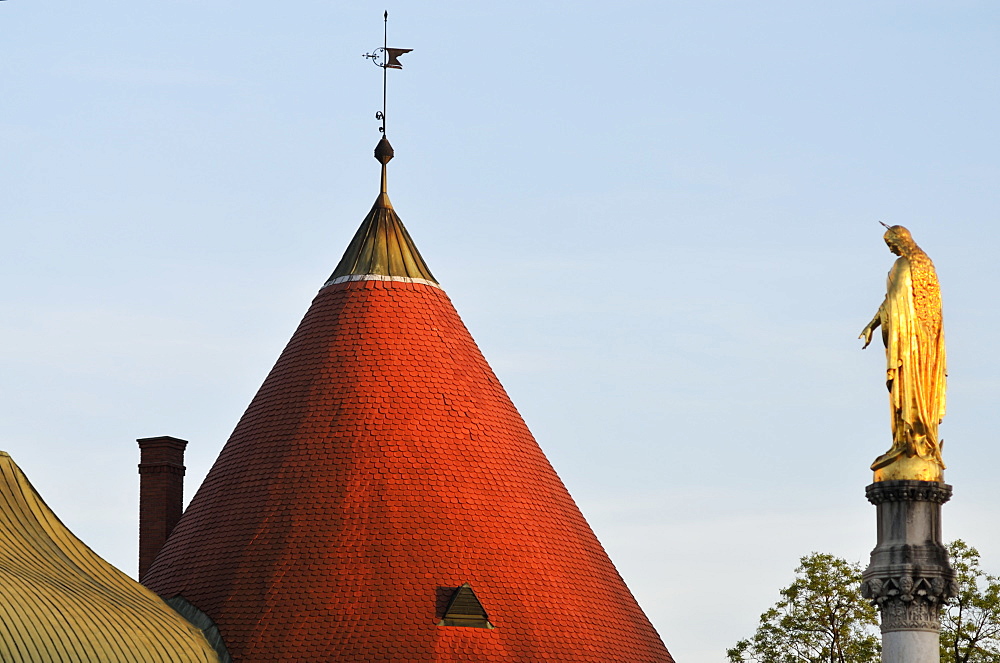 A Peaked Cone Roof With Weather Vane And A Gold Statue Against A Blue Sky, Croatia