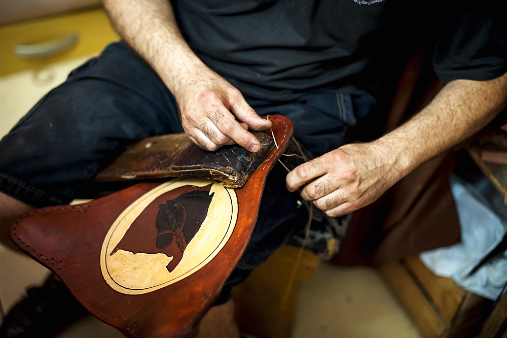 A Craftsman's Hands Working On Leather, Pelotas, Rio Grande Do Sul, Brazil