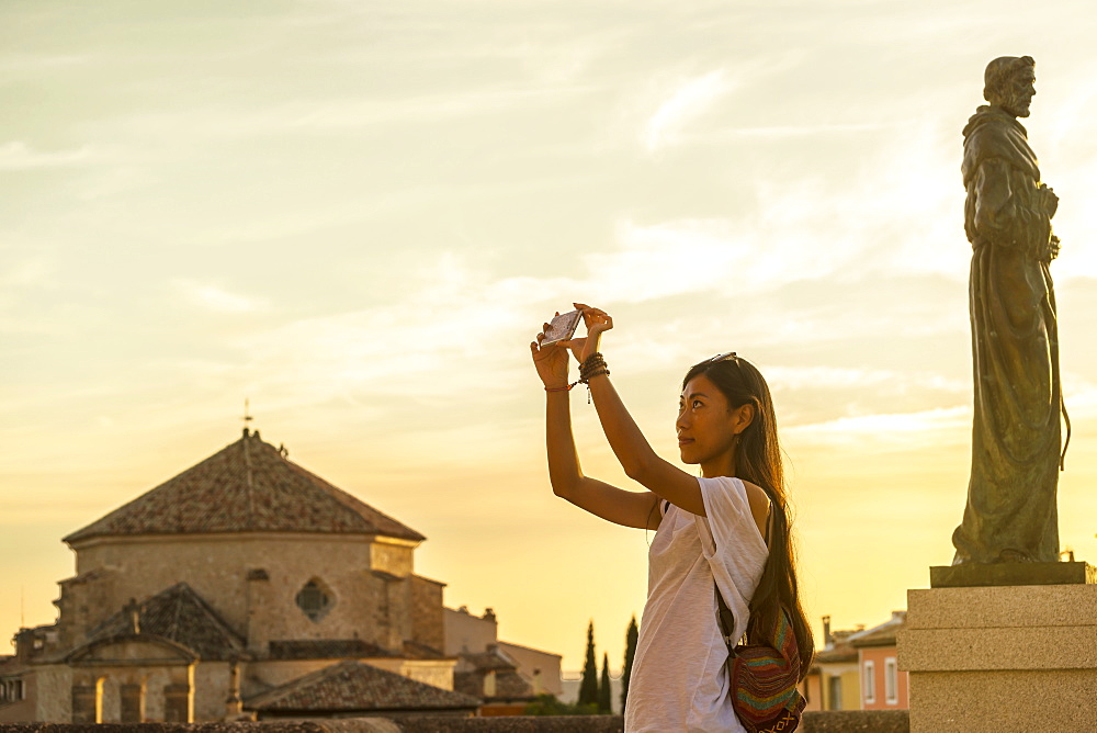 Young Chinese Woman Taking A Picture With Her Phone, Cuenca, Castile-La Mancha, Spain