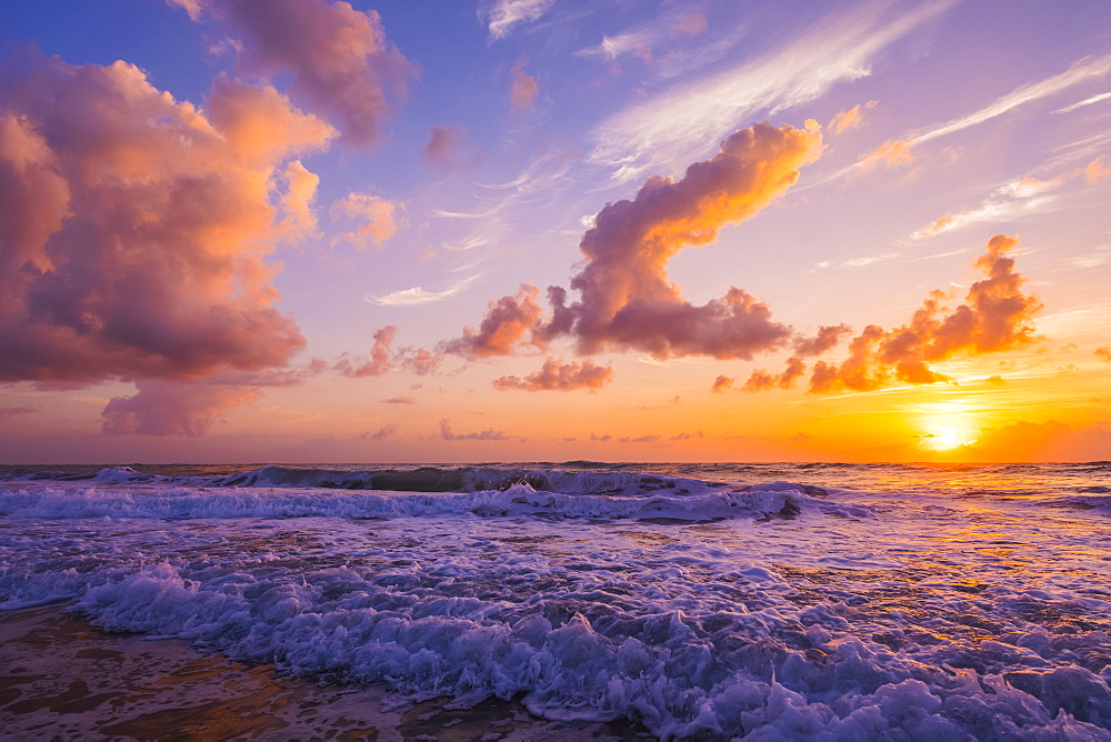 Sunrise over the Atlantic Ocean with the surf washing up on the shore, Indialantic, Florida, United States of America