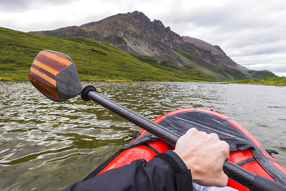 Point of view shot of paddling a pack raft on Landmark Gap Lake near the Denali Highway, Alaska, United States of America