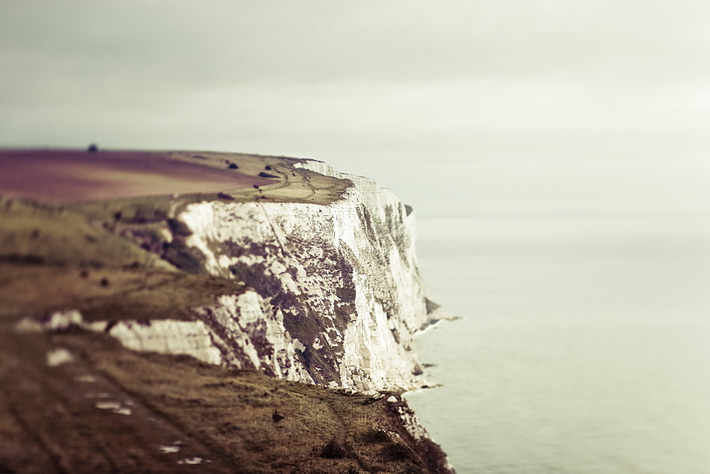 Rugged white cliffs along the coastline, Dover, England