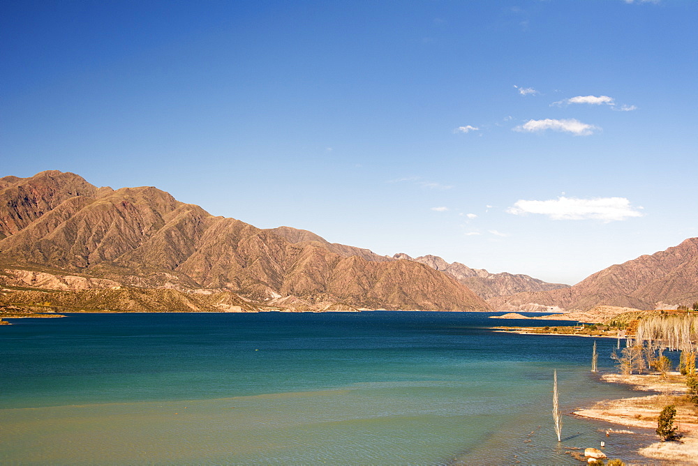 A Lake Surrounded By Colourful Desert Mountains, Potrerillos, Mendoza, Argentina