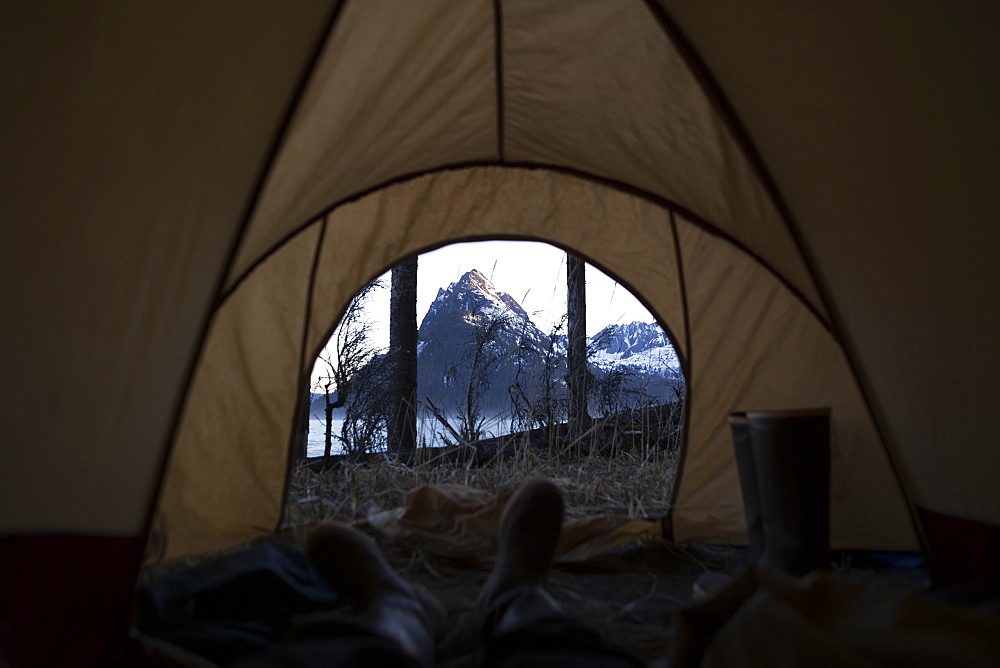 View From Inside A Tent Through The Door To The Rugged Peaks Of The Kenai Mountains, Kachemak Bay State Park, Alaska, United States Of America