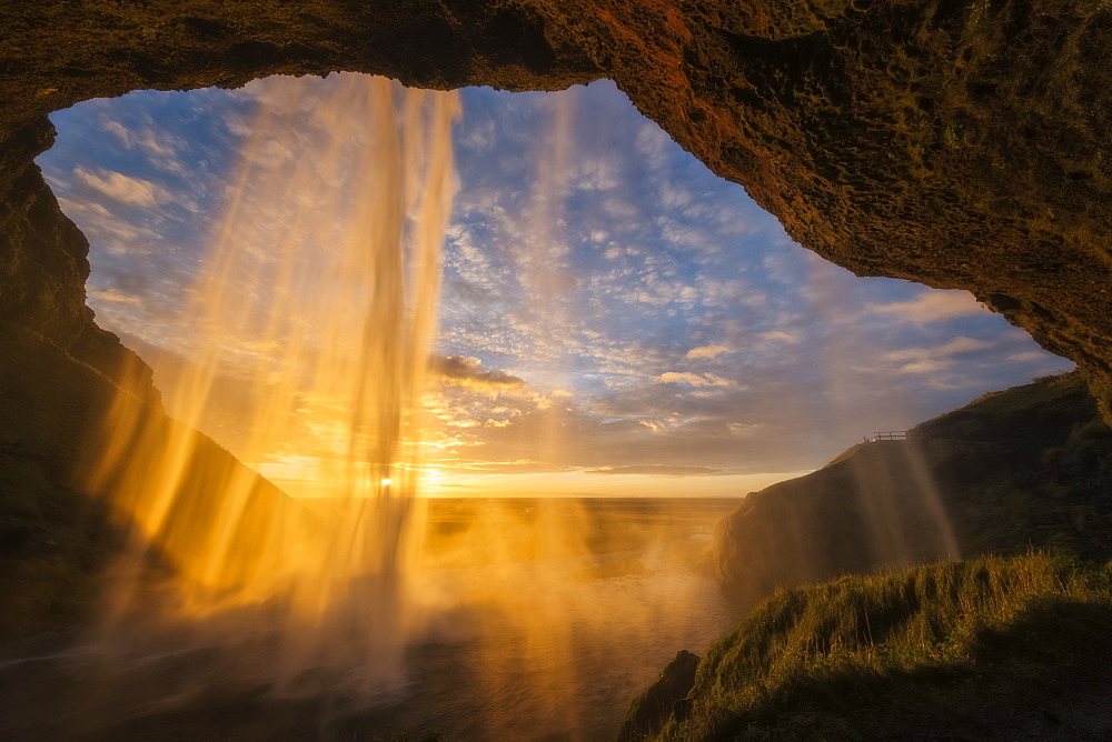 Sunset Light Shines Through The Water Of Seljandefoss Along The South Coast, Iceland