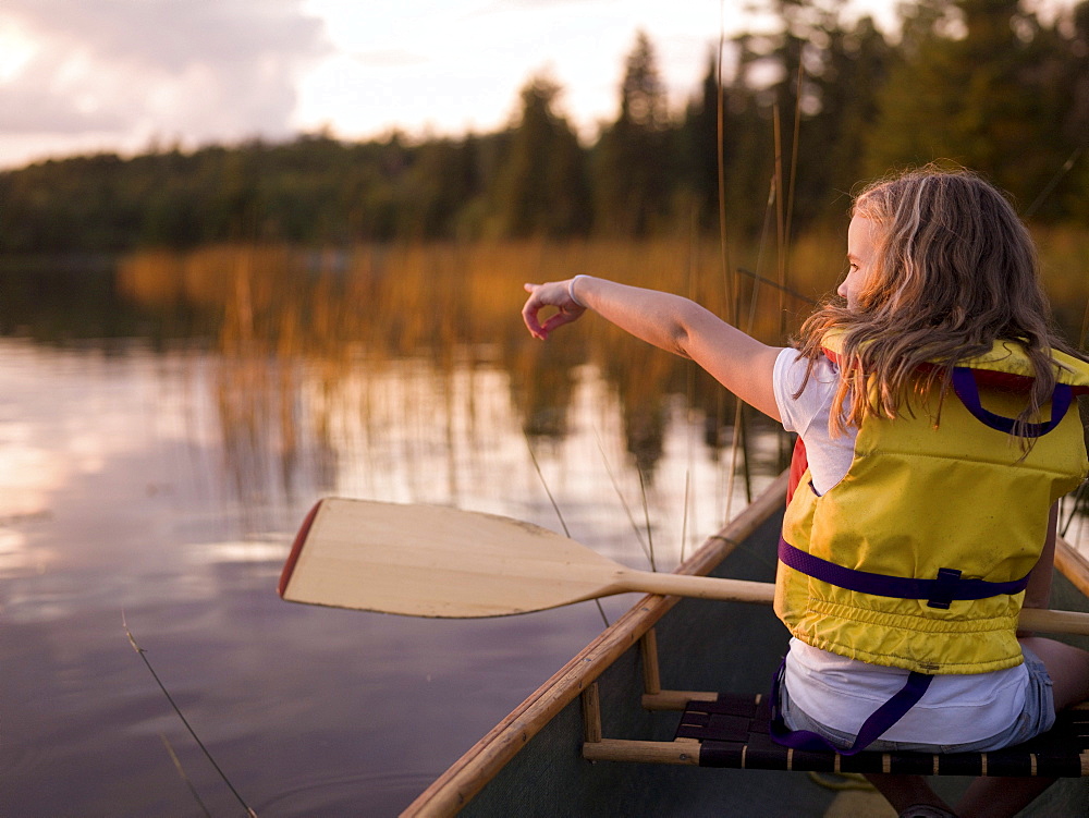 Lake Of The Woods, Ontario, Canada; Girl In A Canoe