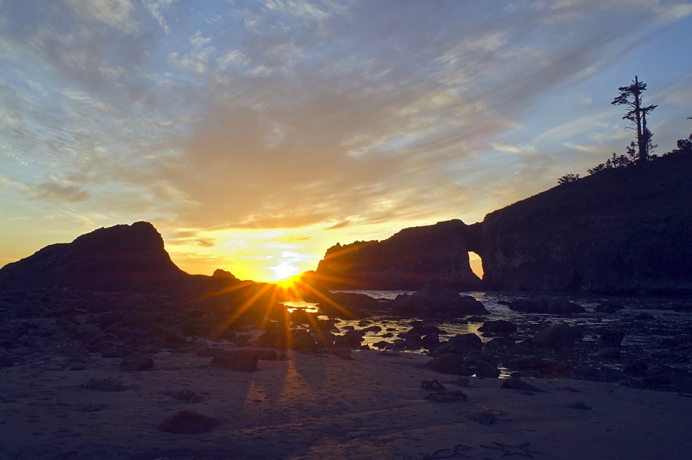 Olympic National Park, Washington, United States Of America; Sunset Arch And The Sun Setting Over Second Beach