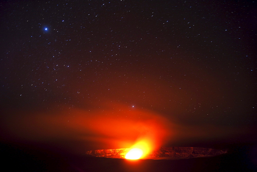 Hawaii, United States Of America; Halema'uma'u Vent Inside Kilauea Crater Glows From Molten Lava At Night With Star Field In The Sky