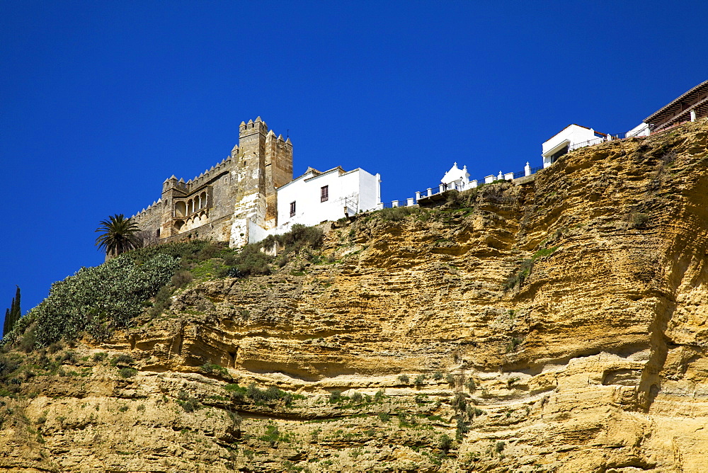 Arcos De La Frontera, Andalusia, Spain; A View Of The Old Town On Top Of A Cliff