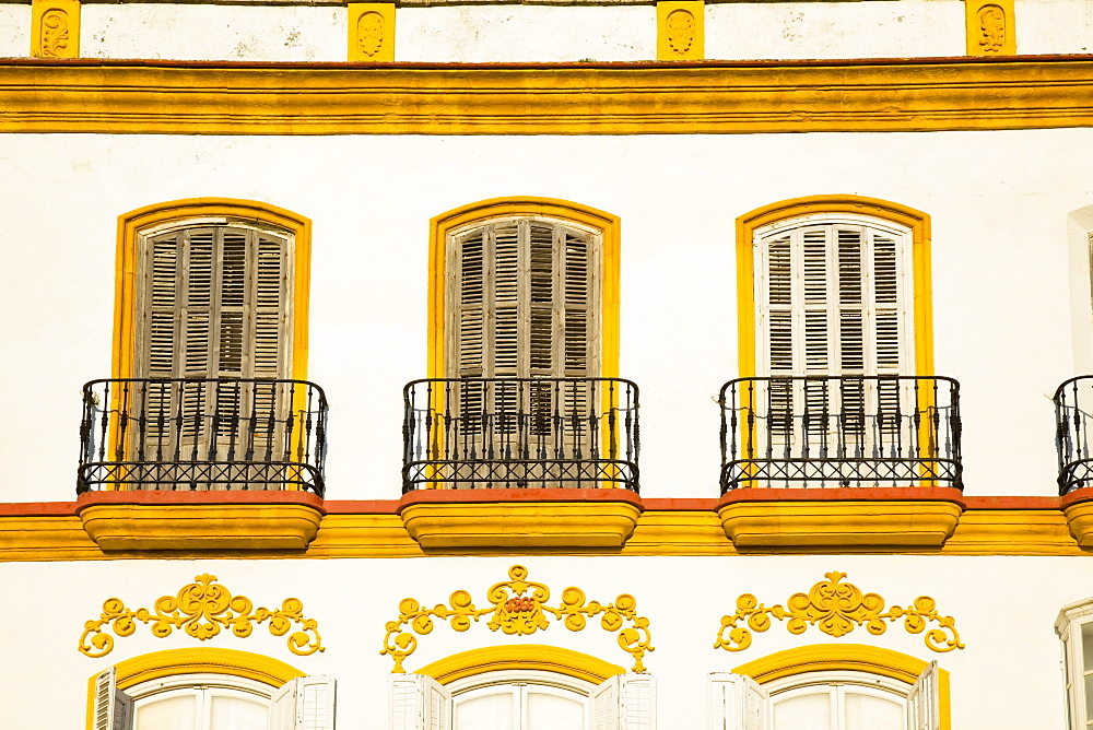 Medina Sidonia, Andalusia, Spain; A White House With Windows And Ledges Trimmed In Gold