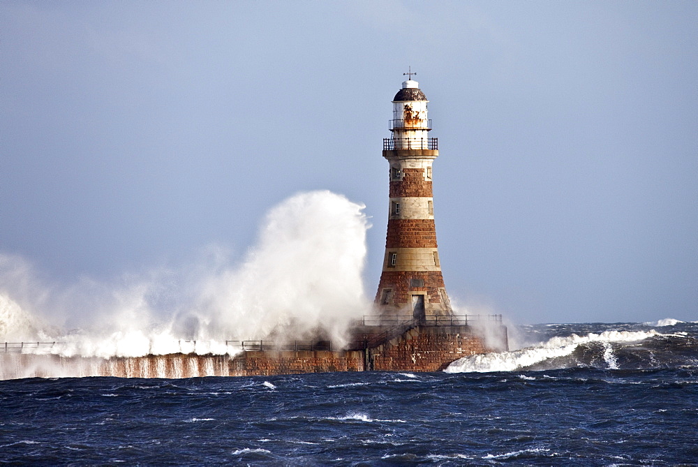 Waves Crashing Against Roker Lighthouse; Sunderland, Tyne And Wear, England