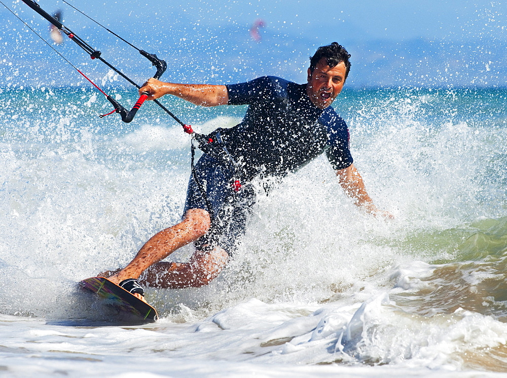 Kite Surfing In Front Of Hotel Dos Mares; Tarifa, Cadiz, Andalusia, Spain