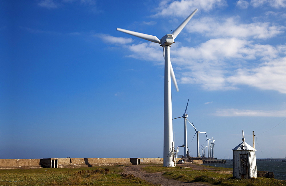 Wind Turbines On A Pier Along The Coast; Blyth, Northumberland, England