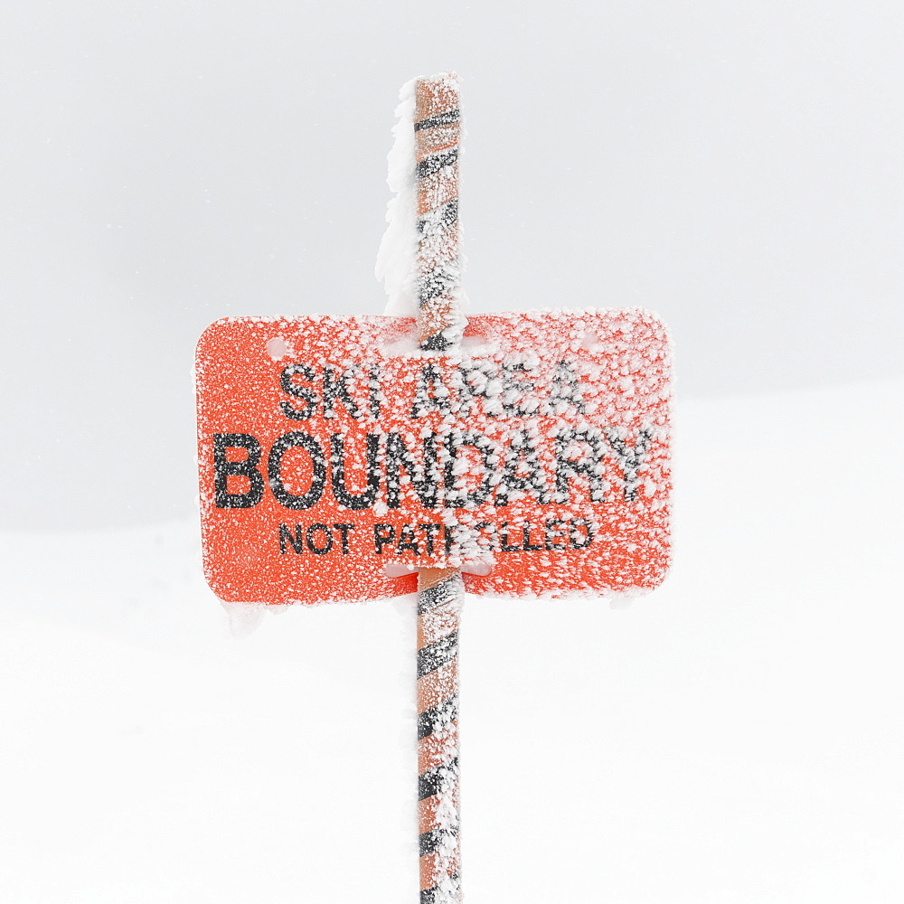 Snow Covering A Ski Area Boundary Sign, Whistler, British Columbia, Canada