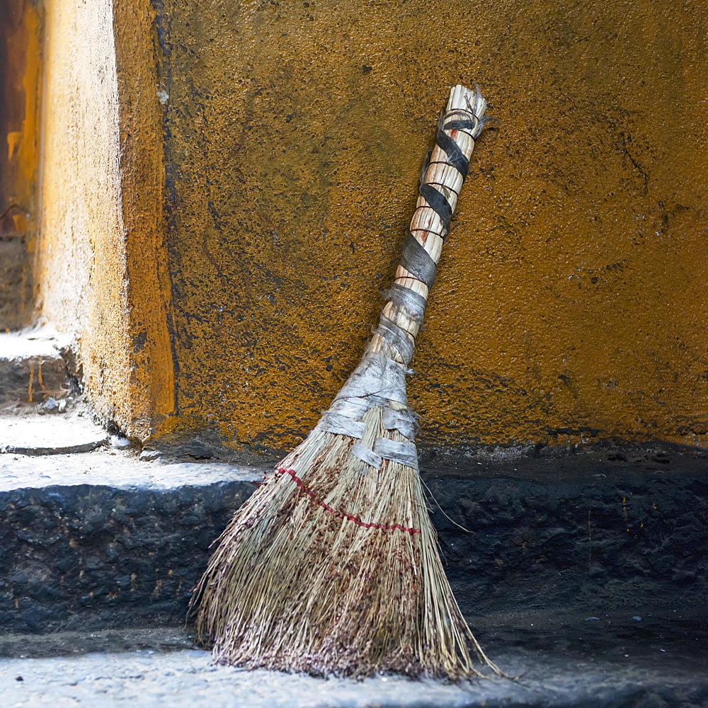 A broom sitting outside a doorway, Lhasa xizang china