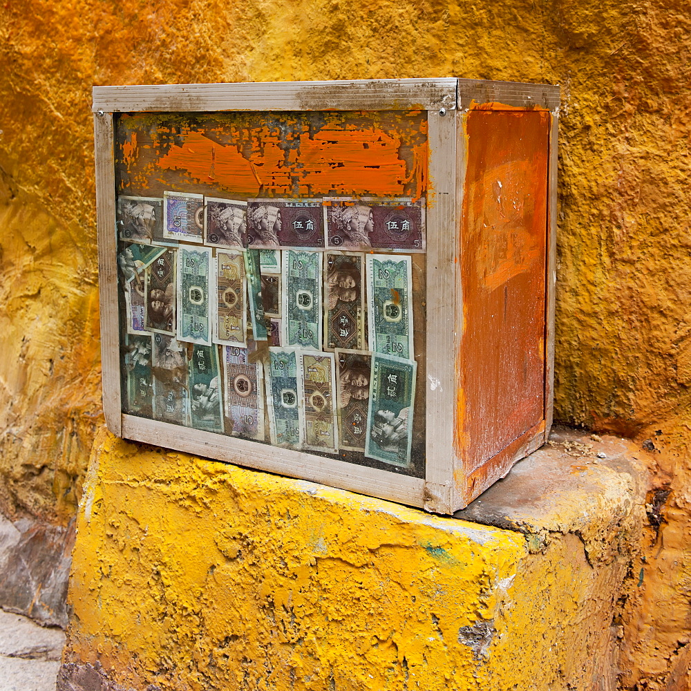 Currency attached to a weathered wooden crate at drepung monastery, Lhasa xizang china