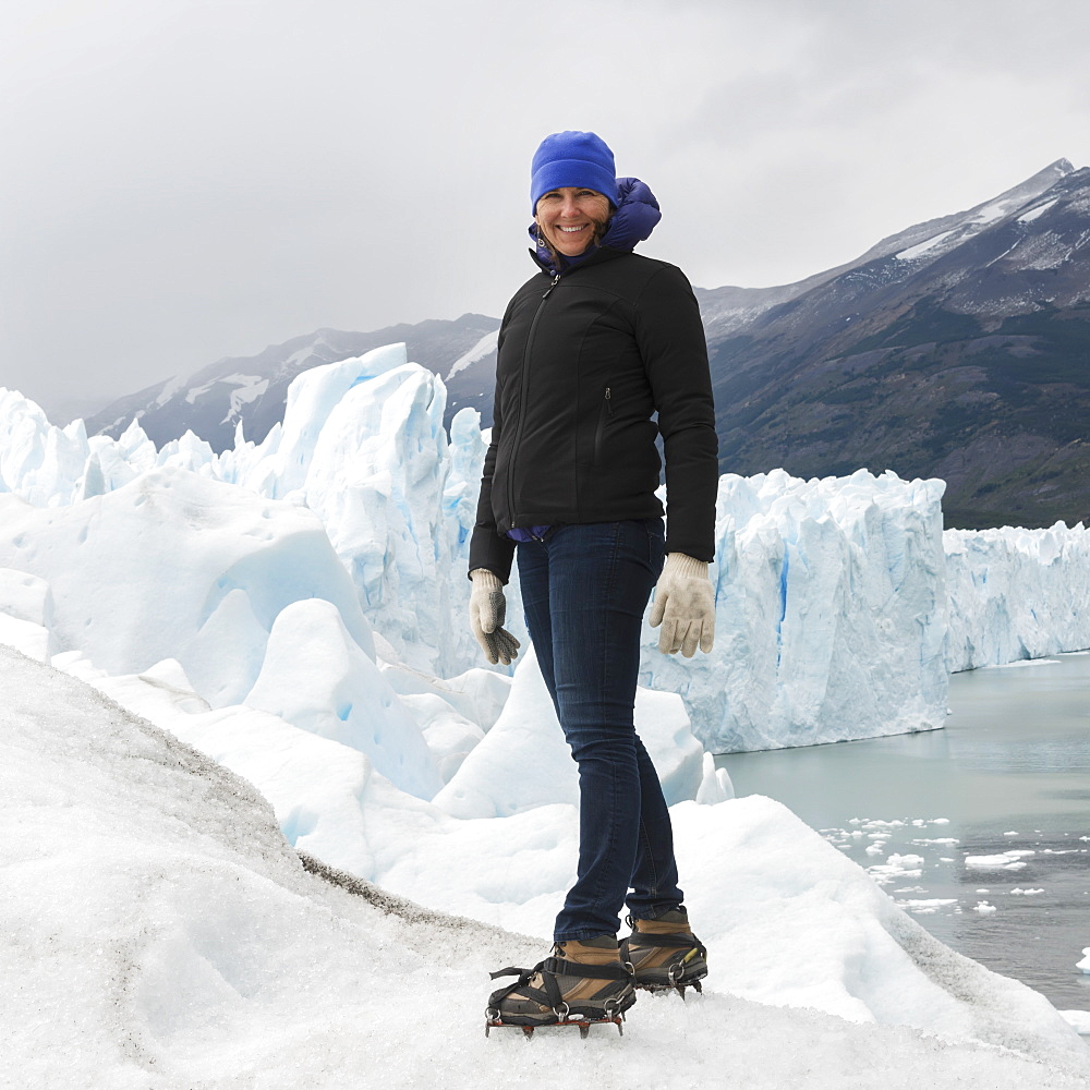 A Woman With Crampon Spikes On Her Hiking Boots On Moreno Glacier, Los Glaciares National Park, Santa Cruz Province, Argentina