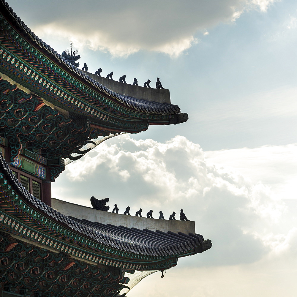 Detailed Roofline Of Gyeongbokgung Palace Against A Blue Sky With Cloud, Seoul, South Korea