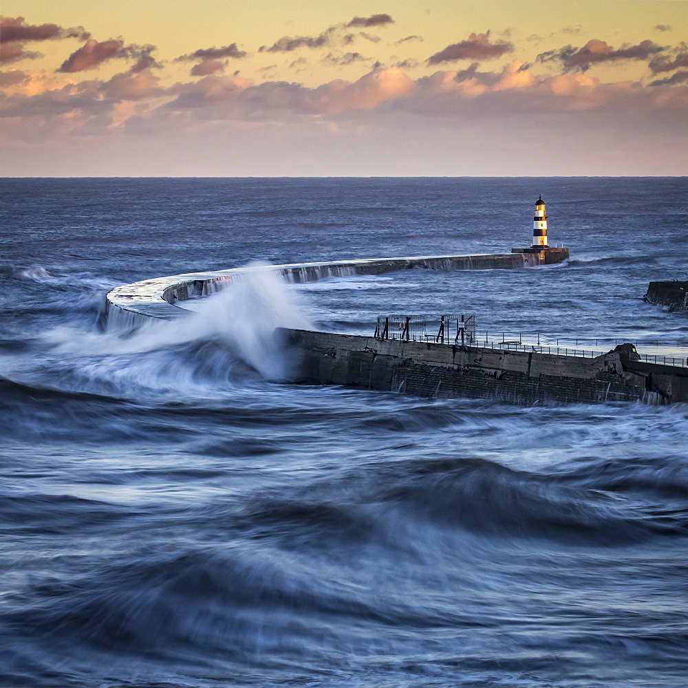 Waves Splashing On The Pier With A Glowing Sky At Sunset, Seaham, County Durham, England