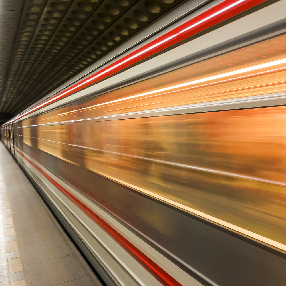 Motion Blur Of The Side Of A Train Passing Through A Station, Prague, Czech Republic