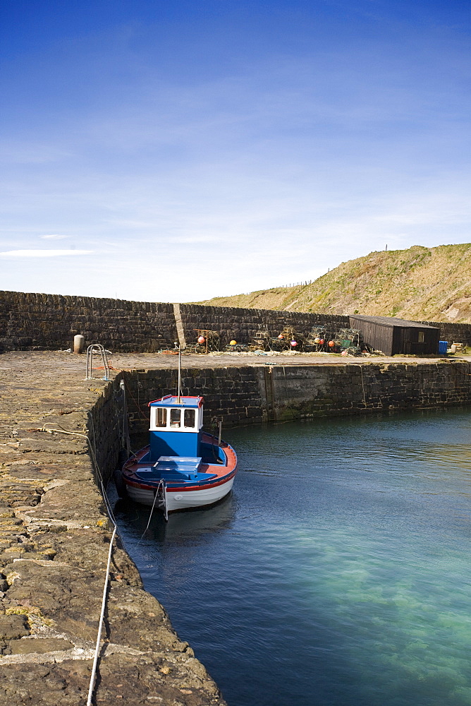 Tugboat Moored To Stone Dock, Scotland