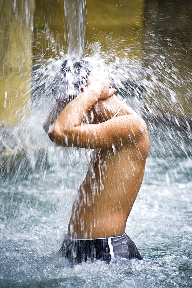 Man Under Waterfall