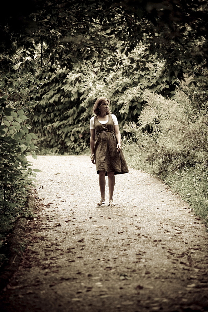 Woman On A Forest Path