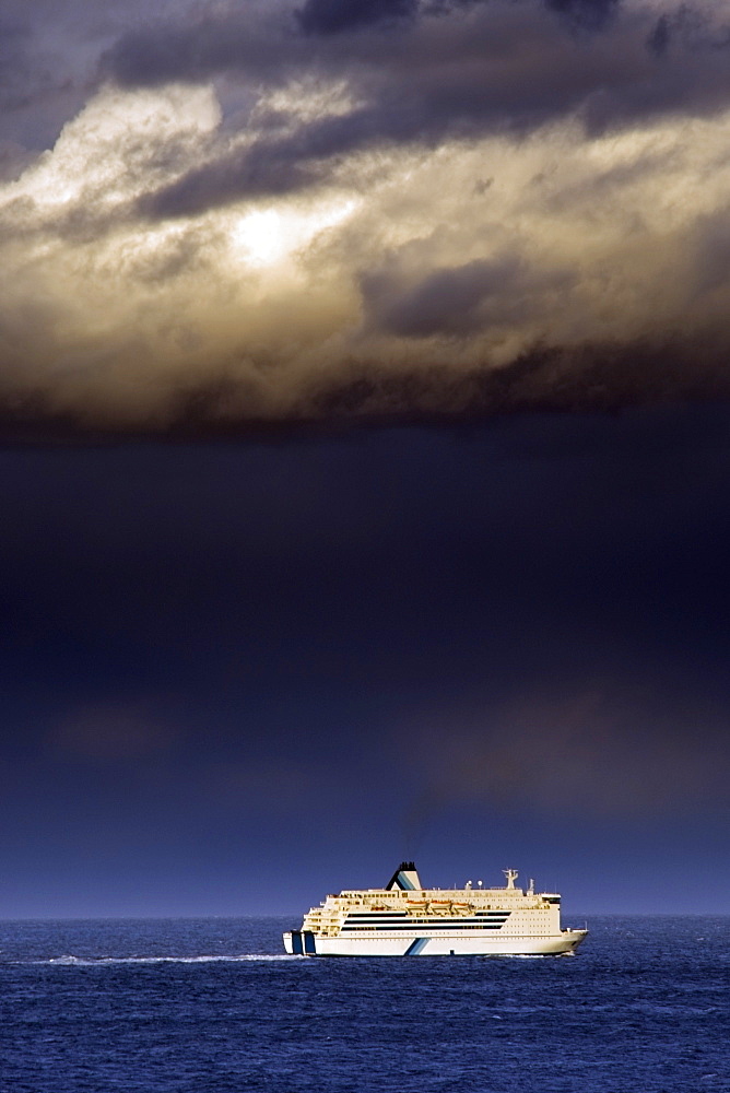 Cruise Ship Under A Dark Cloud