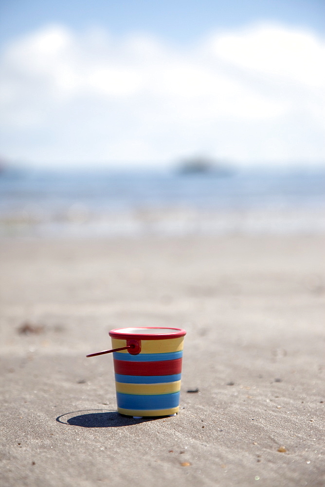 Sand Bucket On Beach, Boulmer Beach, Northumberland, England