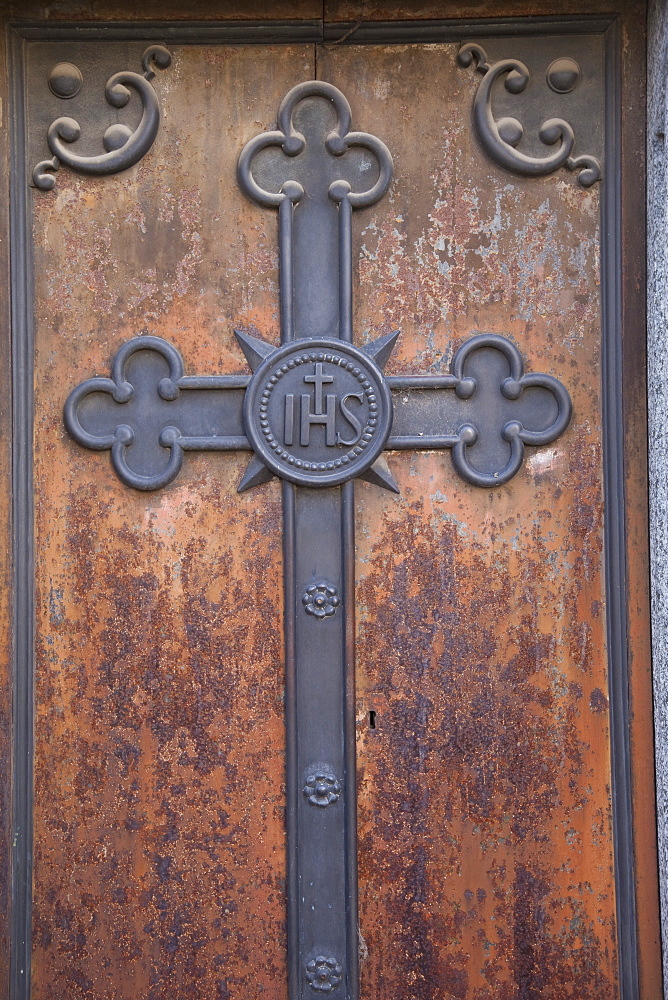 Buenos Aires, Argentina, A Metal Cross On A Wooden Door Of A Tomb In Recoleta Cemetery