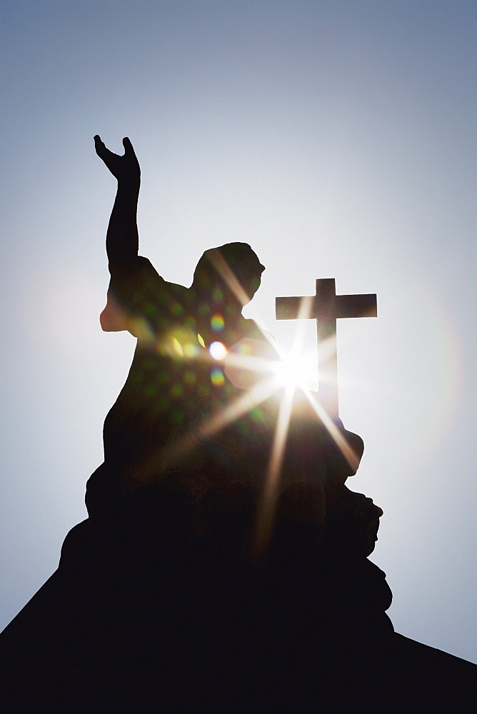 Silhouette Of A Statue And Cross With A Sun Burst, Strasbourg, France