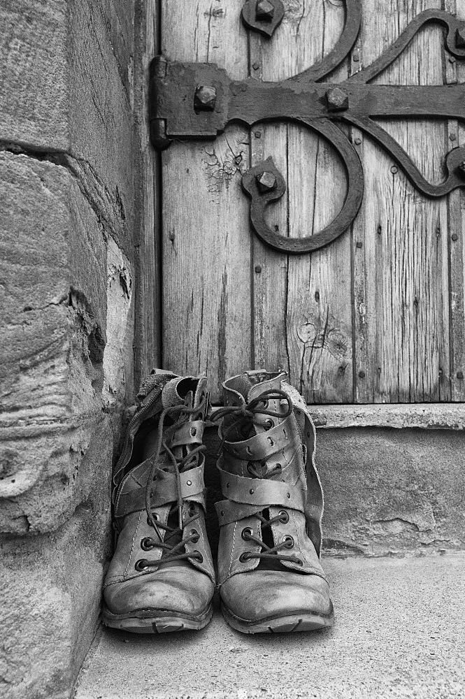 A Pair Of Worn Boots Outside A Door, Northumberland, England