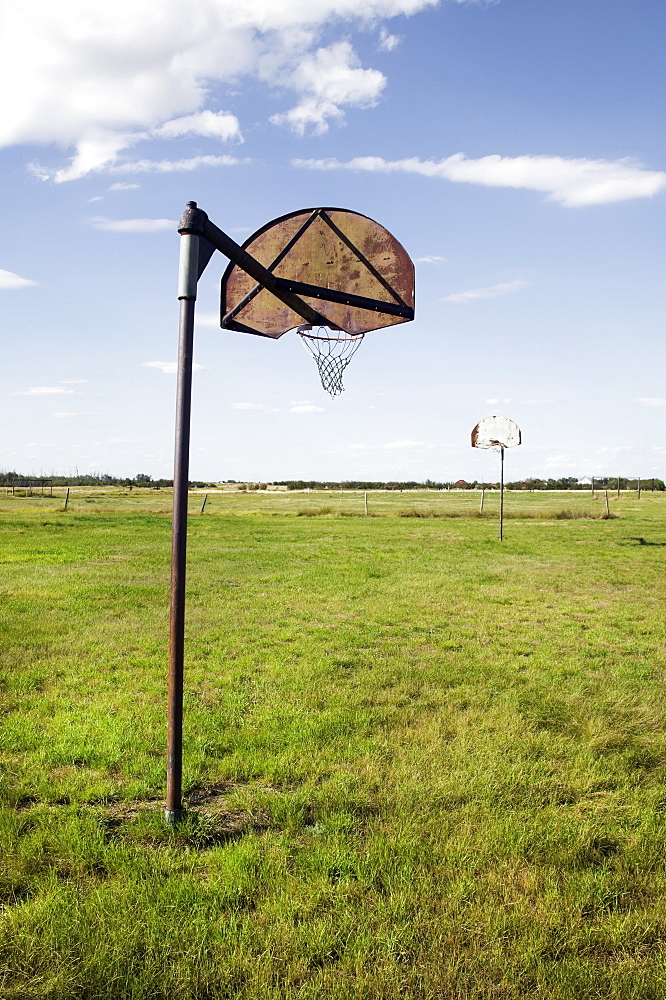 Basketball nets in a grass field, Saskatchewan canada