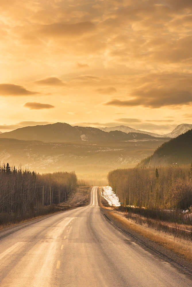 Sunrise over the alaska highway west of fort nelson, in the canadian rockies in early spring, British columbia, canada