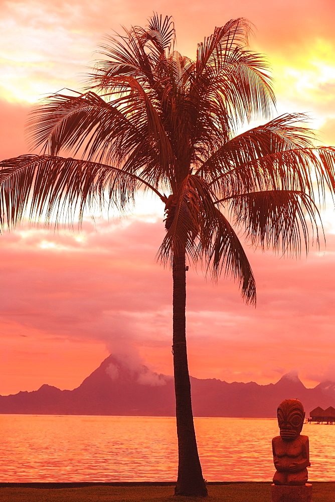 Sunset over moorea from sofitel maeva beach resort near papeete, Tahiti nui society islands french polynesia south pacific